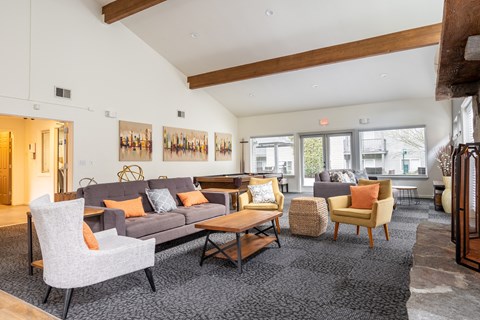 a living room filled with furniture and a fireplace